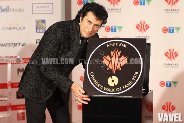 Say cheese! Montreal-born singer-songwriter Andy Kim poses with his star on Canada’s Walk of Fame.