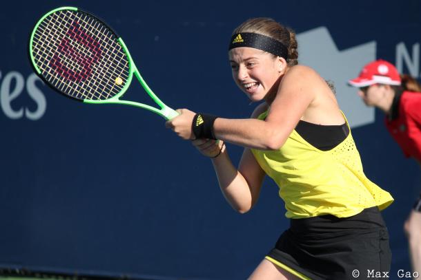 Jelena Ostapenko hits a backhand during her first-round doubles match with Gabriela Dabrowski at the 2017 Rogers Cup presented by National Bank. | Photo: Max Gao