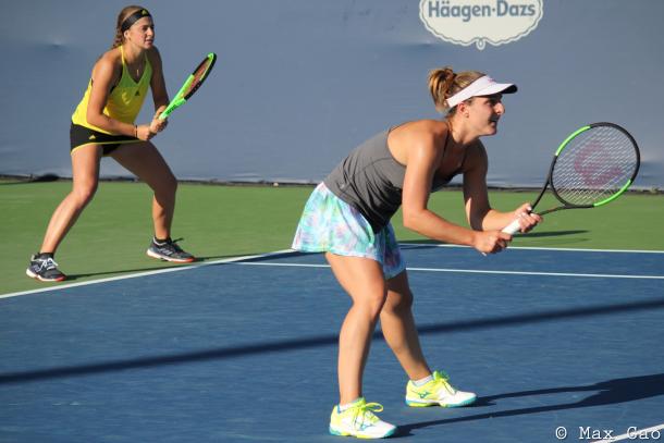 A combination that works: Jelena Ostapenko covering the back of the court while Gabriela Dabrowski looks for the perfect opportunity to attack at the net. | Photo: Max Gao