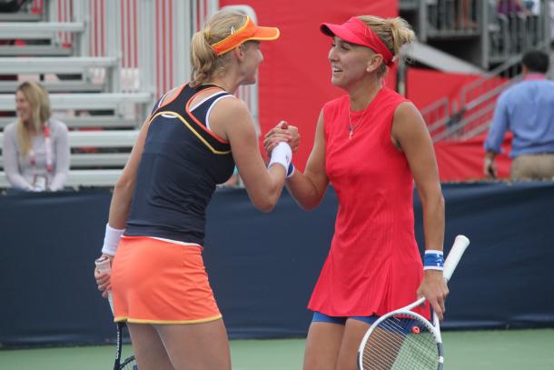 Ekaterina Makarova and Elena Vesnina greet each other after their second-round victory over Bianca Andreescu and Carson Branstine at the 2017 Rogers Cup presented by National Bank. | Photo: Max Gao