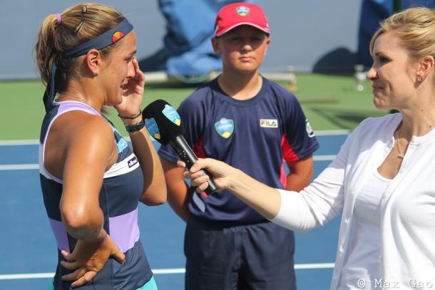 A very emotional Monica Puig talks on the one-year anniversary of her historic triumph in Rio with interviewer Blair Henley after qualifying for the main draw at the 2017 Western & Southern Open. | Photo: Max Gao