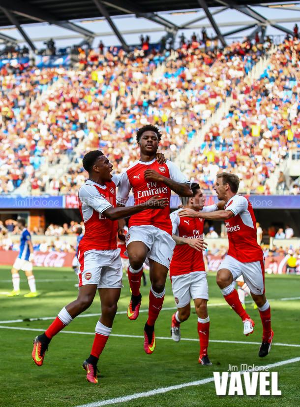 Chuba Akpom celebrates with team mates after scoring the game-winning goal in the 87th minute for Arsenal