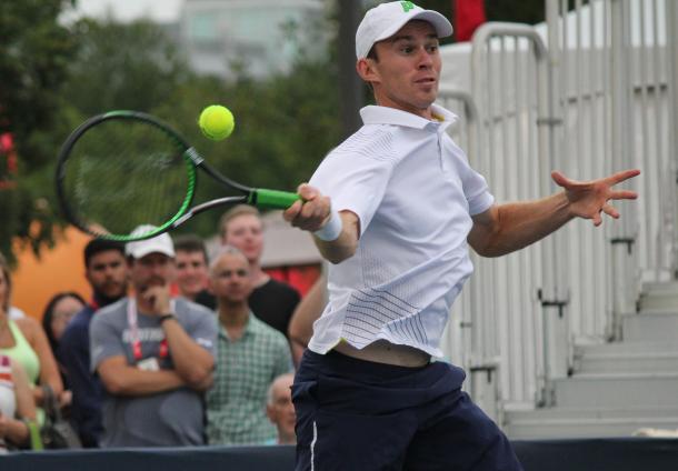 John Peers hits a forehand during his third round doubles match with Henri Kontinen against Grigor Dimitrov and Stan Wawrinka at the 2016 Rogers Cup. | Photo: Max Gao