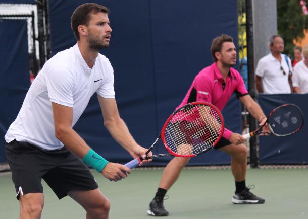 Grigor Dimitrov and Stan Wawrinka in action during their second round doubles match against Henri Kontinen and John Peers at the 2016 Rogers Cup. | Photo: Max Gao