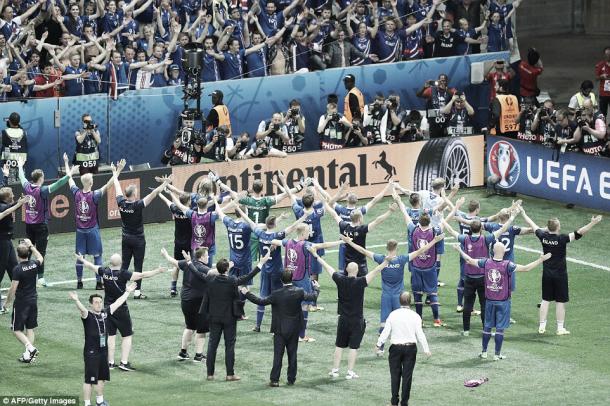 Above: Iceland players and staff celebrating their 2-1 win over England | Photo: AFP/Getty Images 