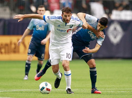  Ignacio Piatti (center) of the Montreal Impact holds off Matias Laba (right) of the Vancouver Whitecaps and he dribbles the ball upfield during their MLS game March 6, 2016 at BC Place in Vancouver, British Columbia, Canada. Montreal won 3-2 / Jeff Vinnick - Getty Images