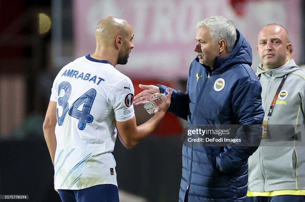 Ex United player Sofyan Amrabat talking with his new manager, <strong><a  data-cke-saved-href='https://www.vavel.com/en/football/2024/08/15/chelsea-fc/1192720-chelseas-five-most-memorable-opening-day-matches.html' href='https://www.vavel.com/en/football/2024/08/15/chelsea-fc/1192720-chelseas-five-most-memorable-opening-day-matches.html'>Jose Mourinho</a></strong> (Photo by Defodi Images)