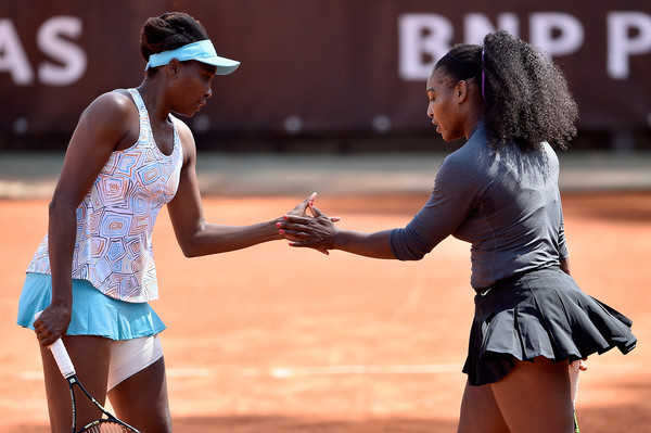 Serena and Venus Williams high five after a point during their first round doubles match at the 2016 Internazionali BNL d'Italia. | Photo:Dennis Grombkowski/Getty Images Europe