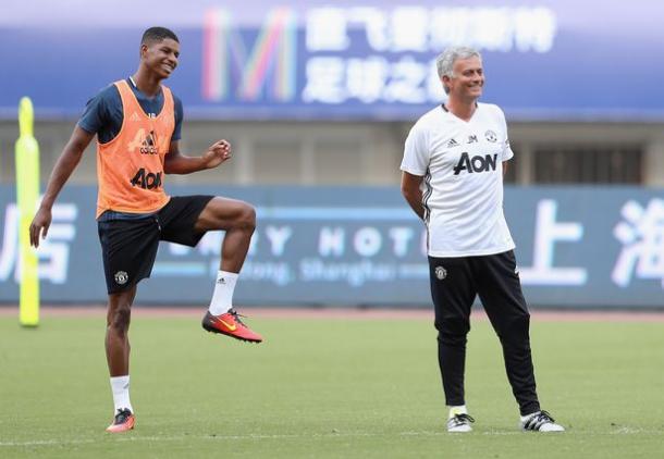 Marcus Rashford (left) and José share a joke during a United training session. 