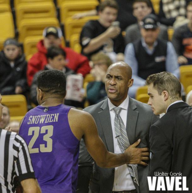 Head Coach Louis Rowe of James Madison has to be held back by Ramone Snowden (23) after recieving a Technical Foul. Photo: Walter Cronk