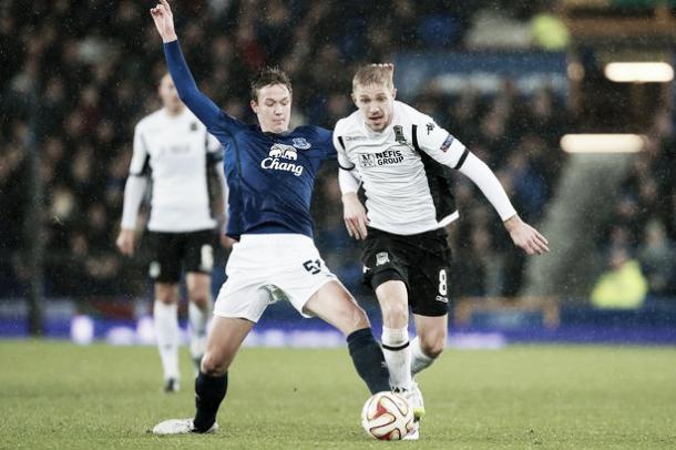 Dowell (left) battles for the ball with Krasnodar's Yury Gazinskiy in the Europa League. | Image: Liverpool Echo