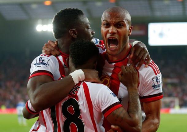 Sunderland's Lamine Kone (left) celebrates scoring with Younes Kaboul and Jermain Defoe. | Photo: The Chronicle Live