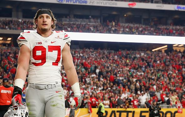Defensive lineman Joey Bosa #97 of the Ohio State Buckeyes walks off the field after being ejected for targeting during the first quarter of the BattleFrog Fiesta Bowl against the Notre Dame Fighting Irish at University of Phoenix Stadium on January 1, 2016 in Glendale, Arizona. The Buckeyes defeated the Fighting Irish 44-28. (Photo by Christian Petersen/Getty Images