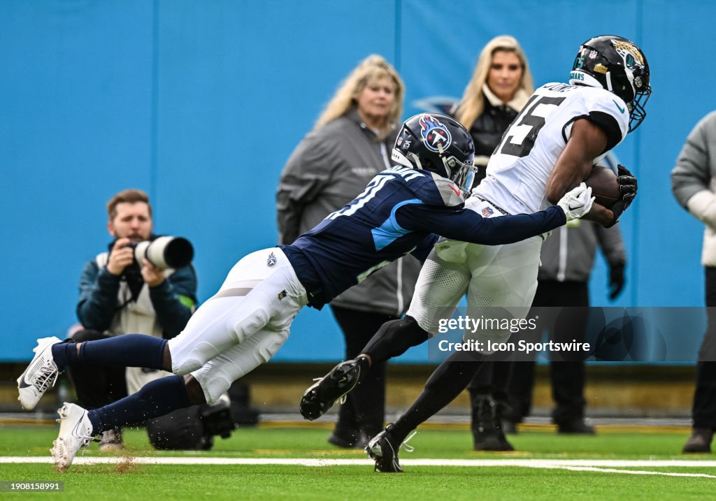 Tennessee Titans cornerback Roger McCreary (21) tackles Jacksonville Jaguars wide receiver Tim Jones (15) during the NFL game between the Tennessee Titans and the Jacksonville Jaguars on January 7, 2024, at Nissan Stadium in Nashville, TN. (Photo by Bryan Lynn/Icon Sportswire via Getty Images)