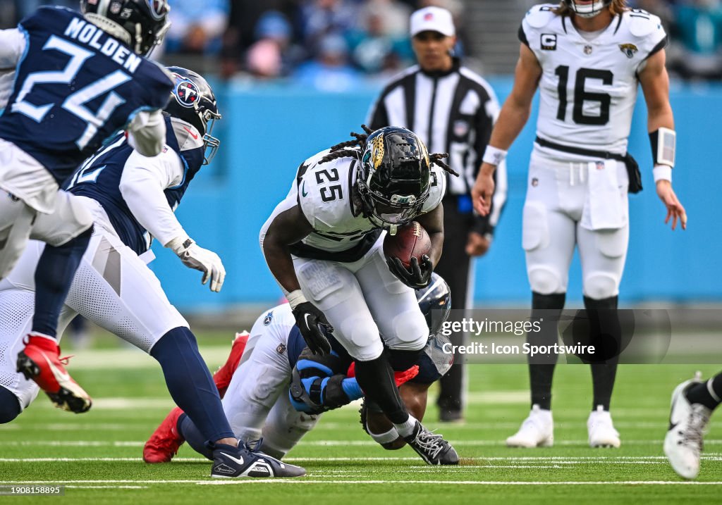Tennessee Titans linebacker Azeez Al-Shaair (2) tackles Jacksonville Jaguars running back D'Ernest Johnson (25) in the backfield during the NFL game between the Tennessee Titans and the Jacksonville Jaguars on January 7, 2024, at Nissan Stadium in Nashville, TN. (Photo by Bryan Lynn/Icon Sportswire via Getty Images)