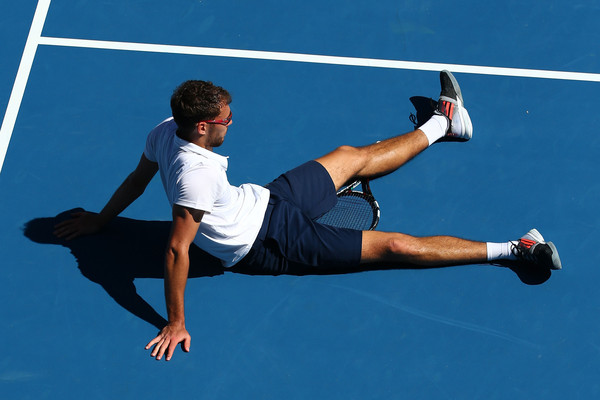 Jerzy Janowicz sits on the court during the 2015 Australian Open. Photo: Quinn Rooney/Getty Images