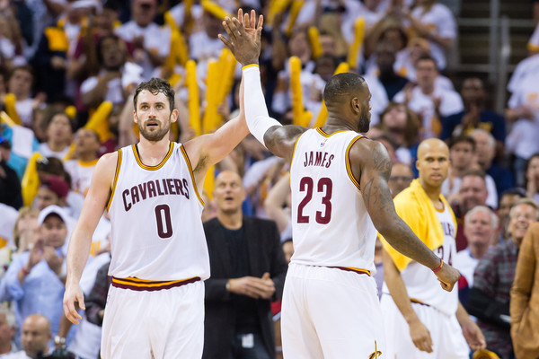 Kevin Love #0 and LeBron James #23 of the Cleveland Cavaliers celebrate during the second quarter of the NBA Eastern Conference Quarterfinals against the Detroit Pistons at Quicken Loans Arena on April 17, 2016 in Cleveland, Ohio. The Cavaliers defeated the Pistons 106-101. NOTE TO USER: User expressly acknowledges and agrees that, by downloading and or using this photograph, User is consenting to the terms and conditions of the Getty Images License Agreement. (April 16, 2016 - Source: Jason Miller/Getty Images North America)