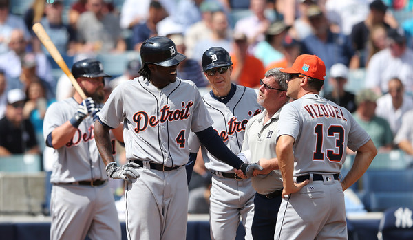 TAMPA FL- MARCH 2: Detroit Tigers outfielder Cameron Maybin #4 gets hit in the hand with a pitch and is looked after by trainer Kevin Rand during the first inning of the Spring Training game against the New York Yankees at George Steinbrenner Field in Tampa, Florida. (March 1, 2016 - Source: Leon Halip/Getty Images North America)