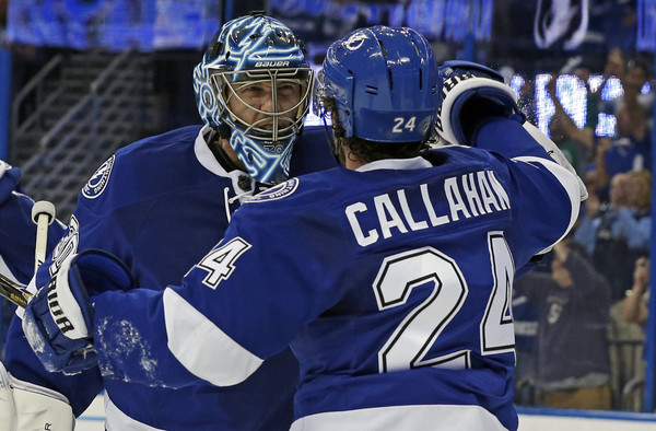 Ben Bishop #30 of the Tampa Bay Lightning celebrates with Ryan Callahan #24 after the series win over the Detroit Red Wings in Game Five of the Eastern Conference First Round during the 2016 NHL Stanley Cup Playoffs at Amalie Arena on April 21, 2016 in Tampa, Florida. (April 20, 2016 - Source: Mike Carlson/Getty Images North America)