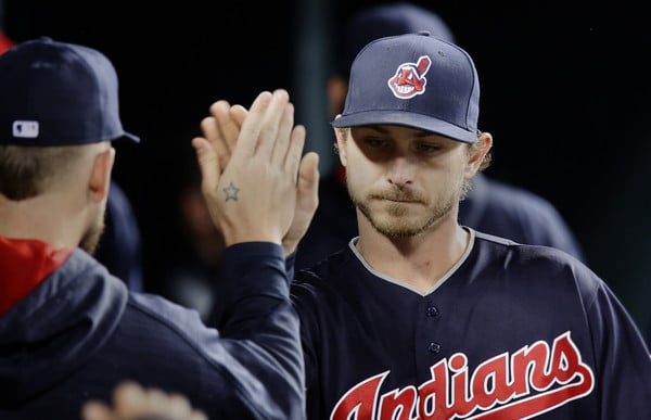 Pitcher Josh Tomlin #43 of the Cleveland Indians is congratulated in the dugout after being relieved during the seventh inning of a game against the Detroit Tigers at Comerica Park on April 22, 2016 in Detroit, Michigan. Tomlin recorded his second win in the Indians 2-1 victory over the Tigers. (April 21, 2016 - Source: Duane Burleson/Getty Images North America) 
