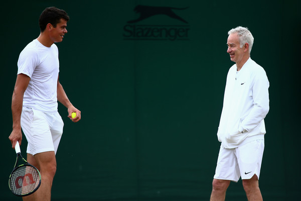 Milos Raonic and John McEnroe laugh during a practice session at Wimbledon. | Photo: Jordan Mansfield/Getty Images Europe