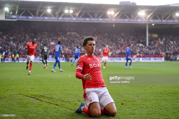 NOTTINGHAM, ENGLAND - FEBRUARY 06: <strong><a  data-cke-saved-href='https://vavel.com/en/football/2022/02/04/leicester-city/1100574-nottingham-forest-vs-leicester-city-preview-how-to-watch-team-news-predicted-line-ups-and-ones-to-watch.html' href='https://vavel.com/en/football/2022/02/04/leicester-city/1100574-nottingham-forest-vs-leicester-city-preview-how-to-watch-team-news-predicted-line-ups-and-ones-to-watch.html'>Brennan Johnson</a></strong> of Nottingham Forest celebrates after scoring their team's second goal during the Emirates FA Cup Fourth Round match between Nottingham Forest and <b><a  data-cke-saved-href='https://vavel.com/en/data/leicester-city' href='https://vavel.com/en/data/leicester-city'>Leicester City</a></b> at City Ground on February 06, 2022 in Nottingham, England. (Photo by Laurence Griffiths/Getty Images)