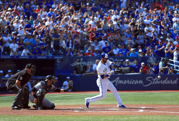 In likely his last home game as a Blue Jay, Bautista got a pair of hits, walked, scored and picked up an RBI with the bases loaded in the fourth inning. | Photo: Vaughn Ridley/Getty Images