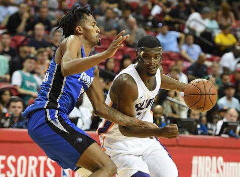 Josh Jackson #20 of the Phoenix Suns drives against Braian Angola-Rodas #19 of the Orlando Magic during the 2018 NBA Summer League. |Ethan Miller/Getty Images North America|