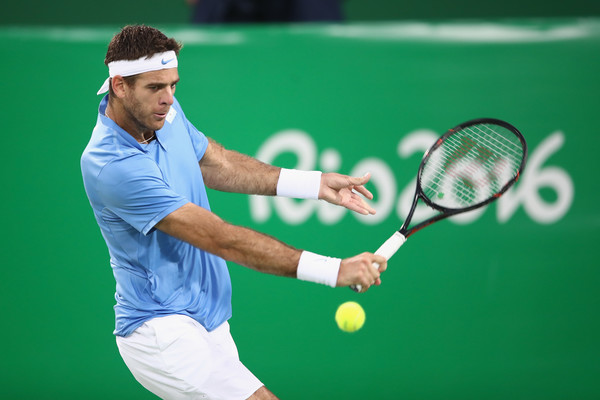 Juan Martin Del Potro plays a backhand to Roberto Bautista Agut in their quarterfinal match at the Olympics/Photo: Mark Kolbe/Getty Images