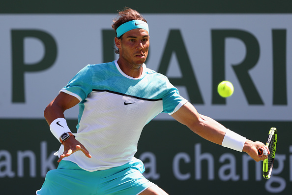 Nadal stretches out to hit the forehand. Credit: Julian Finney/Getty Images