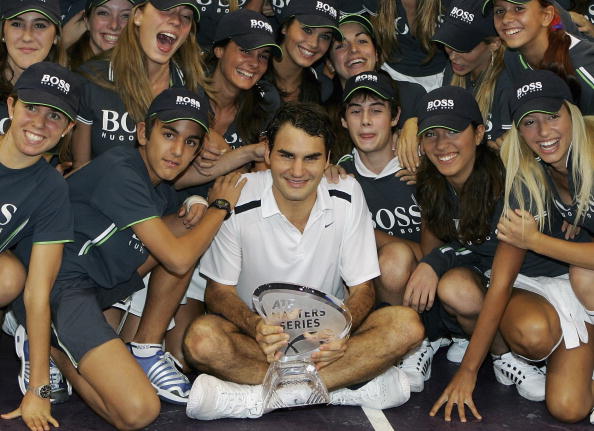 Federer celebrates his first Madrid title in 2006 with the ball-kids. Credit: Julian Finney/Getty Images