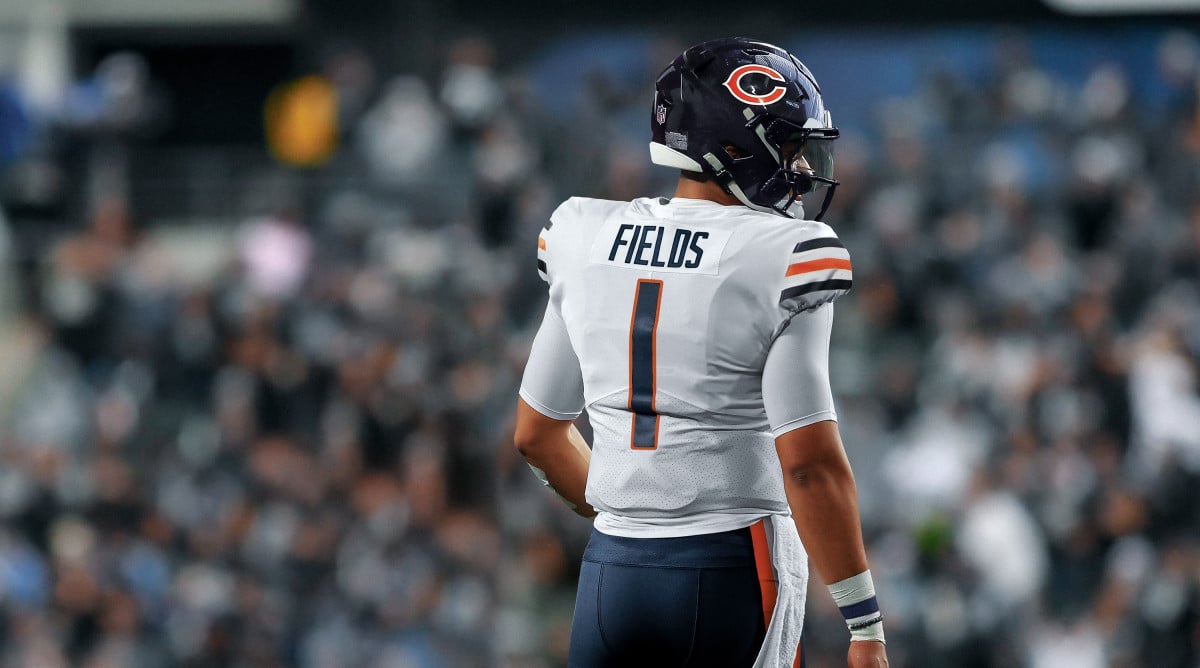 A Chicago Bears fan holds a quarterback Justin Fields jersey before an NFL  football game against the Houston Texans Sunday, Sept. 25, 2022, in  Chicago. (AP Photo/Nam Y. Huh Stock Photo - Alamy