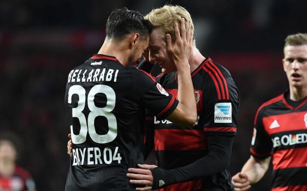 Bellarabi and Brandt embrace. | Image source: Comunio 