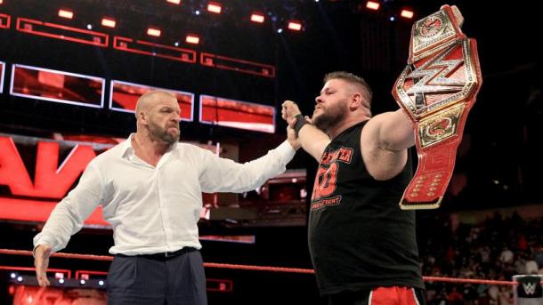 KO celebrating his title win with HHH. Courtesy of WWE.com