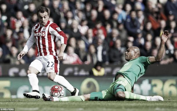 Above: Younes Kaboul slides in on Xherdan Shaqiri in Sunderland's 1-1 draw with Stoke City | Photo: Reuters 