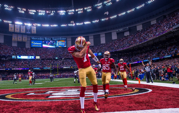 Kaepernick celebrates after scoring a 15 yard touchdown in the 4th quarter of Super Bowl XLVII against the Baltimore Ravens / Rob Tringali - SportsChrome/Getty Images