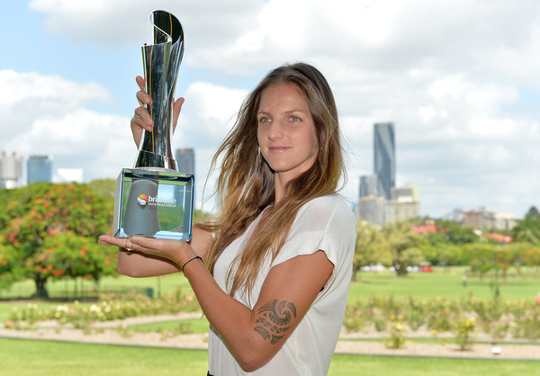 Karolina Pliskova posing alongside her Brisbane International trophy | Photo: Bradley Kanaris/Getty Images AsiaPac