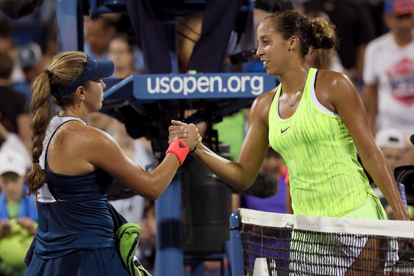Madison Keys and Kayla Day meet and shake hands at the net after their second-round match at the 2016 U.S. Open. | Photo: Michael Reaves/Getty Images North America