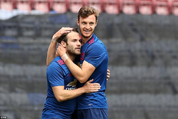 Mata celebrates the first goal of the Mourinho era with Will Keane | Photo: PA