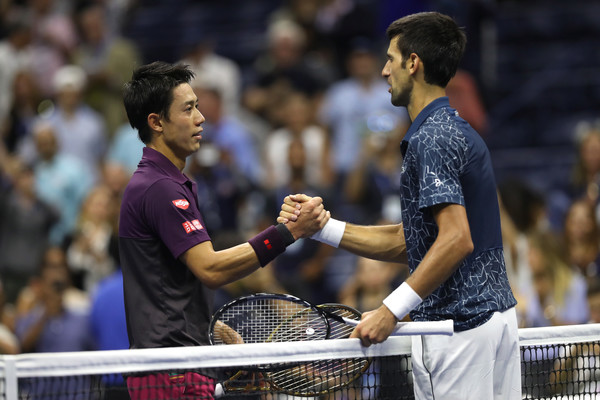 Djokovic and Nishikori exchange some nice words at the net | Photo: Matthew Stockman/Getty Images North America