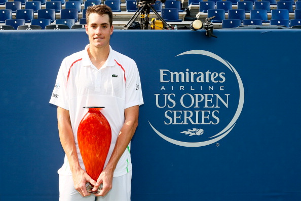 Isner poses with the Atlanta Open title in 2014 (Getty/Kevin C. Cox)