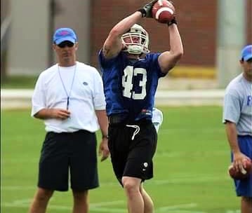 Kile catching a pass in front of former Gators head coach Urban Meyer. Photo Source: gatorcounty.com - Timothy Casey