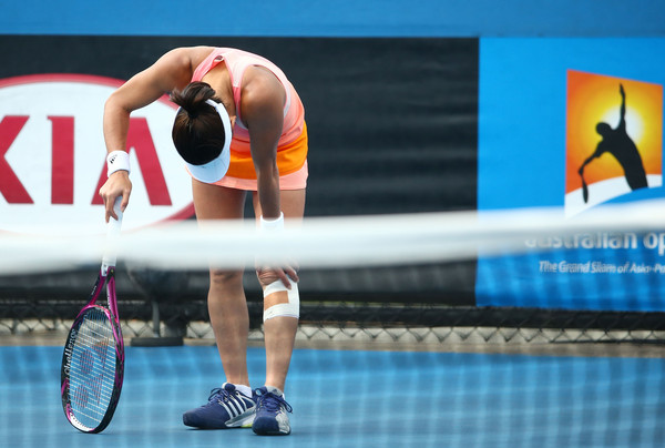 Kimiko Date-Krumm shows signs of pain in her first round match of Australian Open qualifying against Amandine Hesse. (source: Zimbio.com)