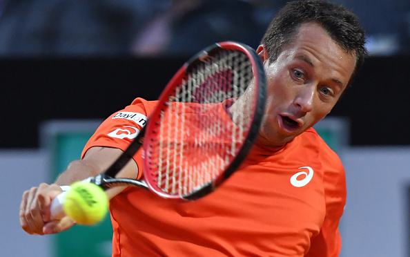 Philipp Kohlschreiber hits a backhand during the match. Photo: Tiziana Fabi/AFP/Getty Images