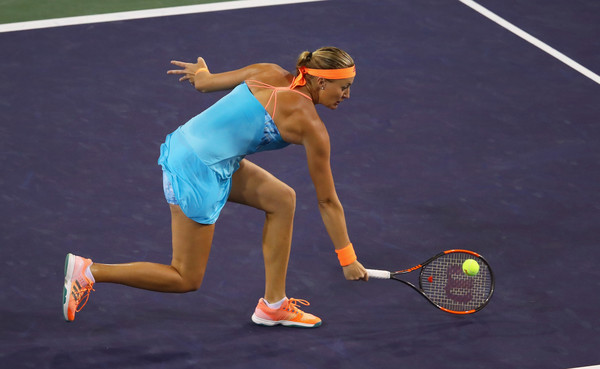 Kristina Mladenovic lunges to hit a backhand volley during her straight-sets defeat to Elena Vesnina in the semifinals of the 2017 BNP Paribas Open. | Photo: Clive Brunskill/Getty Images