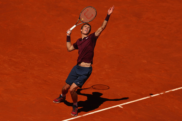 Andrey Kuznetsov serves during his second round match. Photo: Julian Finney/Getty Images