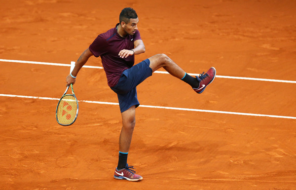 Nick Kyrgios kicks a ball in frustration during his semifinal loss in Madrid. Photo: Clive Brunskill/Getty Images