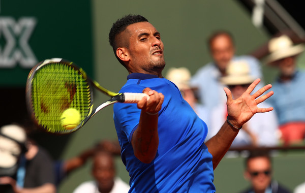 Kyrgios crushes a forehand at the French Open. Photo: Clive Brunskill/Getty Images