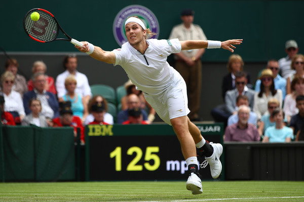 Lukas Lacko lunges for a forehand during his loss to Federer. Photo: Clive Mason/Getty Images