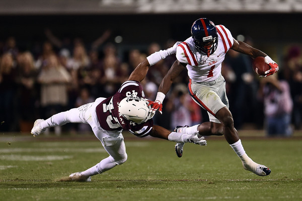 Laquon Treadwell #1 of the Mississippi Rebels avoids a tackle by J.T. Gray #45 of the Mississippi State Bulldogs during the second quarter of a game at Davis Wade Stadium on November 28, 2015 in Starkville, Mississippi. (Nov. 27, 2015 - Source: Stacy Revere/Getty Images North America) 